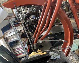 Front fender painted and in place with special fender brackets.